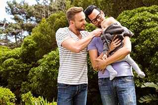 male couple and baby