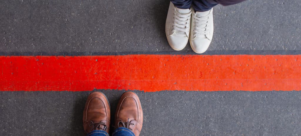 couple standing opposite sides red line relationship