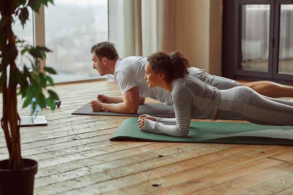 healthy partners doing yoga